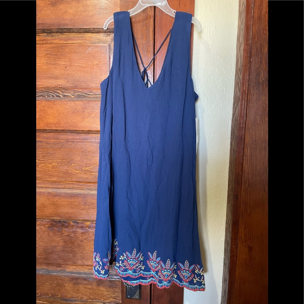 Blue summer dress with trim design.